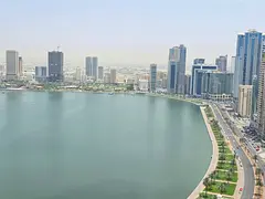 Two-bedroom apartment in Al Majaz 3 with free AC and parking, sea view, maid room, 4 bathrooms and b