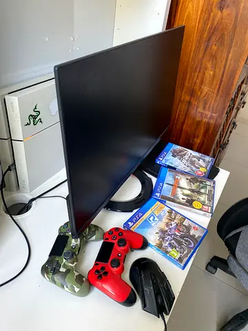 Sony PlayStation 4 Slim with 2 Controllers, Games and Accessories — Good Condition