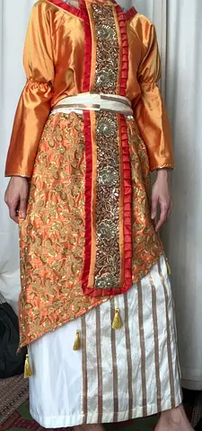 Traditional embroidered womens dress with decorative sash