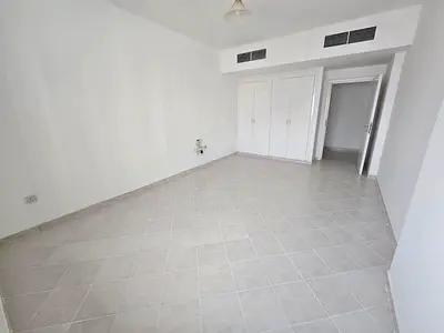 Clean one-bedroom apartment in Al Majaz 1 with free AC, built-in wardrobes and landlord-paid contract attestation, AED 45,000 yearly.