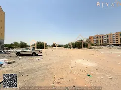 For sale: land in Al Mowaihat 3 Ajman, Academy Street, area 20000 sq ft, G+4 usage, strategic prime