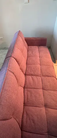 Light mauve fabric sofa bed - compact 2-seater, good condition