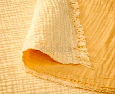 2 Yellow crumpled cotton blanket