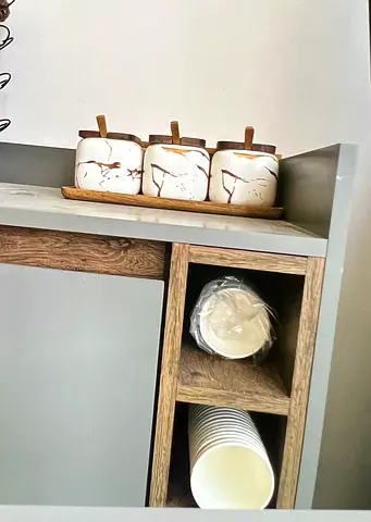 Compact wooden kitchen cabinet with wine rack and storage