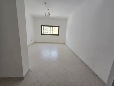 Very clean two-bedroom apartment in Al Majaz 1 with free AC, built-in wardrobes and landlord-paid contract attestation.