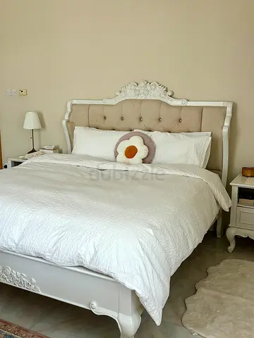 White King Bed with Upholstered Headboard and Floral Decals
