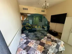 Fully furnished studio for annual rent in a prime location at Al Nuaimiya Towers, featuring a privat