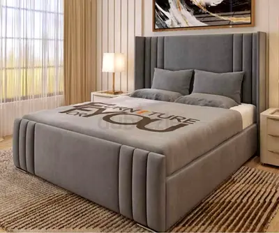Gray Upholstered Platform Bed with Padded Headboard and Storage Base
