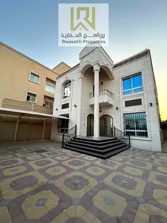 Villa for sale in Al Rawda 2, located in a prime residential area close to the exits of Sheikh Moham
