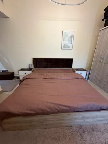 Wooden double bed frame with medicated mattress, bedside tables (used) - neutral oak finish