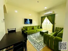 Luxurious two-bedroom apartment with a living room, fully furnished, and featuring a balcony. Ajman,