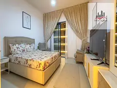 Sharjah studio apartment with comfortable space, kitchen, bathroom, and balcony.