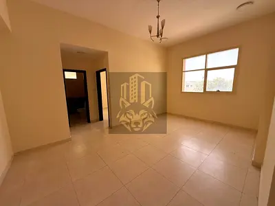 Close to the school complex, a spacious 2-bedroom apartment with a hall and 2 bathrooms, without a balcony, available for annual rent in Al Jurf 2 nea