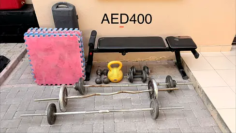 Home gym set — bench, barbells, dumbbells, kettlebell (used), AED400 for all