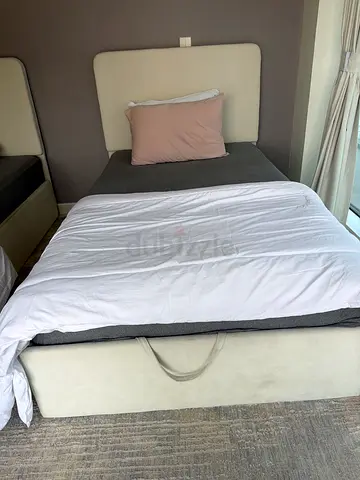 Single upholstered bed frame with headboard and storage base - light beige