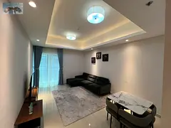 Furnished one-bedroom apartment for daily rent in Gulf Tower, Ajman, directly on Khalifa Street next