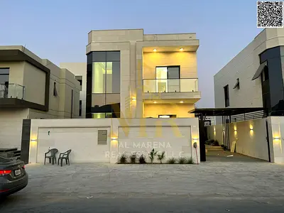 A villa on a street and alley with an elegant design and an exceptional location in Al Zahia