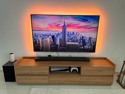 LG 65 OLED Wall-Mounted TV can be table mounted . Excellent Condition