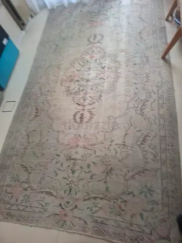 Large vintage-style floral area rug, neutral tones
