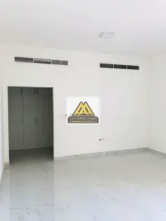 A spacious 1-bedroom apartment with a living room for annual rent in Al Hiliou 2 – Ajman, featurin