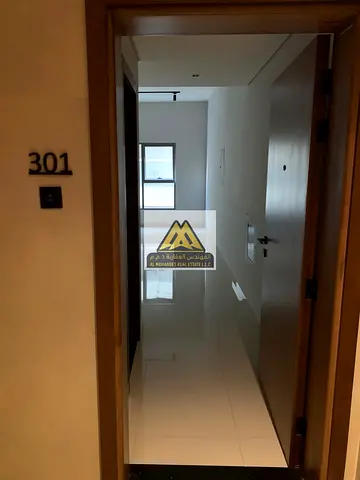 Spacious apartment for annual rent in Al Hamidiya 1, Ajman, featuring an open view balcony, built-in wardrobes, and a practical layout close