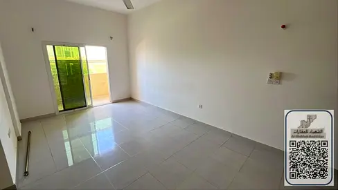 One bedroom and living room in Rawda 2, a steal at 24,000 AED. Two bathrooms, balcony with open view, prime location, free parking. Master bedroom ver