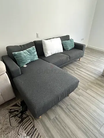 Dark grey L-shaped sofa couch