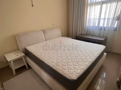 Double bed, 180*200 mattress, two beside tables, and a writing desk. The bed is in perfect condition