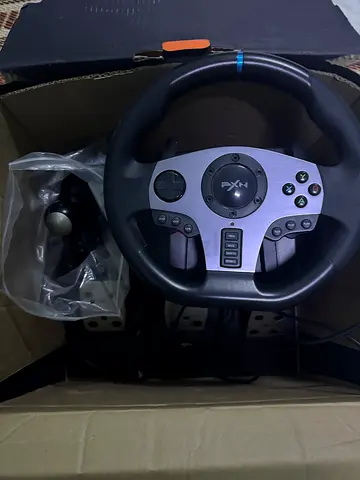 PS4 slim with steering wheel V9 used for 8 months only