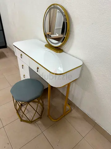 Modern white and gold makeup table with an elegant design