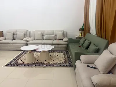 Light grey 3-piece sofa set with green accent loveseat