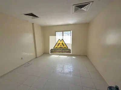 Studio apartment in Al Rashidiya 2, with a semi-separate kitchen, ground floor, central air conditioning, large area, prime location.