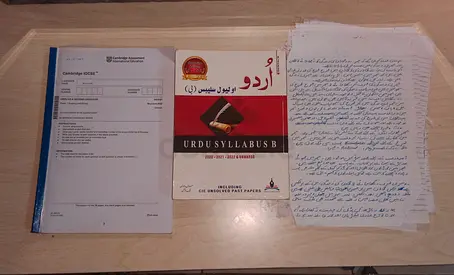 Cambridge Urdu Syllabus B book with handwritten notes and past papers - used