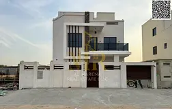 A luxurious villa with a modern design and upscale living in Al Zahia, with a price including electr