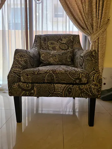 Comfortable patterned single armchair in good condition