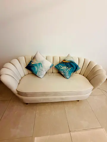 Cream scallop-back 2-seater sofa in velvet upholstery
