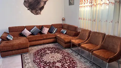 Large L-shaped brown suede sofa with 3 matching chairs