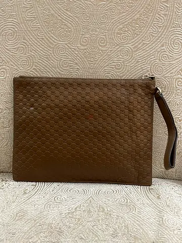 AUTHENTIC GUCCI GUCCISSIMA LEATHER CLUTCH..(UNISEX)