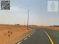 Industrial land for sale in Al Qasimia 1, Sharjah, Phase 1, with installments over 24 months. Area: