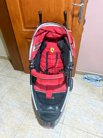 Red single stroller/pram in good used condition