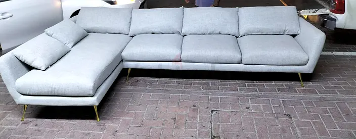 Light grey L-shaped sectional sofa with chaise — 4-seater