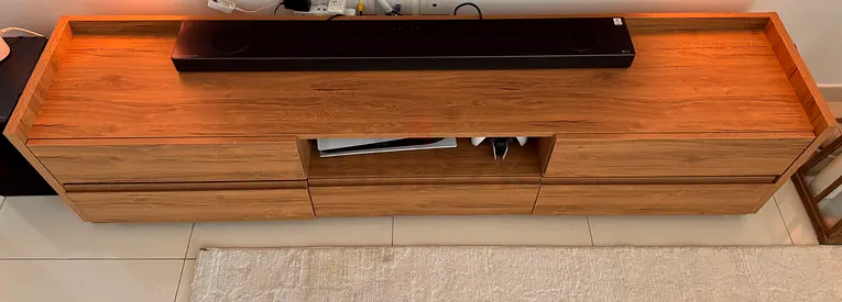 Long wooden TV cabinet with drawers and open shelf