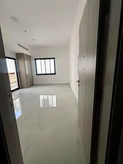 Brand new studio for yearly rent in Al Alia Ajman, semi separate kitchen, balcony, built-in wardrobe