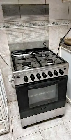 Stainless Steel 4-Burner Gas Stove with Oven - Good Working Condition