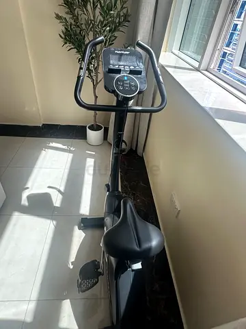 Used upright exercise bike with digital console - perfect condition
