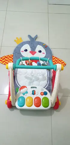 Baby walker with play activity panel and cushioned seat - used