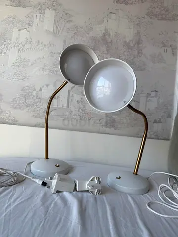2 Lamps for sale with golden flexible stand and a white base