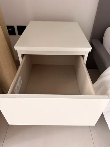 Simple white bedside table with drawers - IKEA