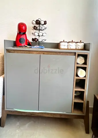 Compact wooden kitchen cabinet with wine rack and storage