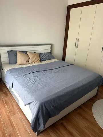 White wooden double bed frame with mattress - good condition